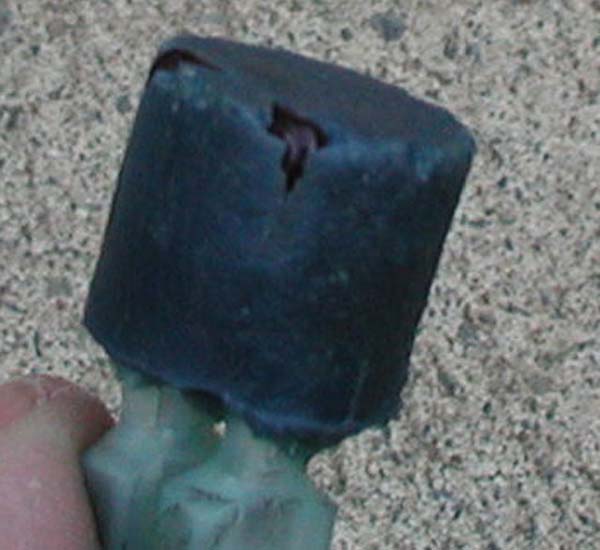 Tuning cap with a hole burned in it