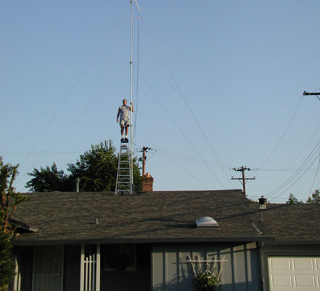 Standing on ladder on top of roof